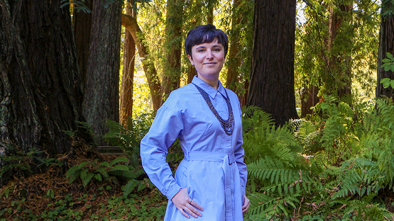 Nell Shaw Cohen in grove of redwood trees